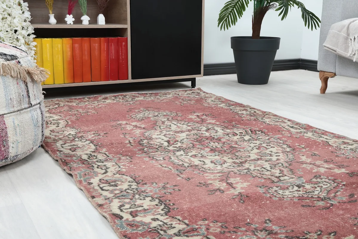 Close-up angle view of the rose rug's intricate floral and medallion pattern.