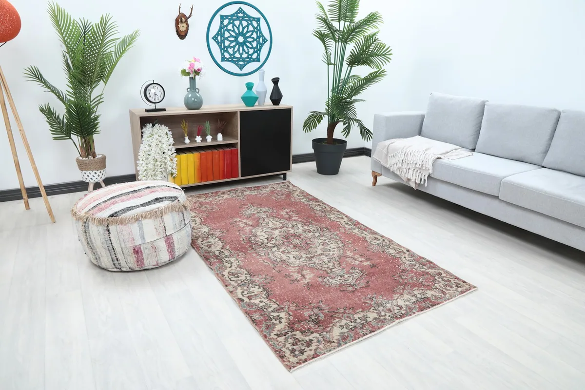 Rose doormat on a light floor, viewed from an angle in a home decor setting.