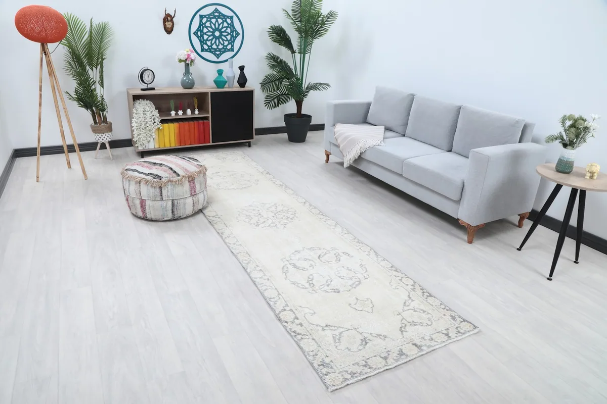 Angled view of the runner rug in a room, highlighting its length and design alongside furniture