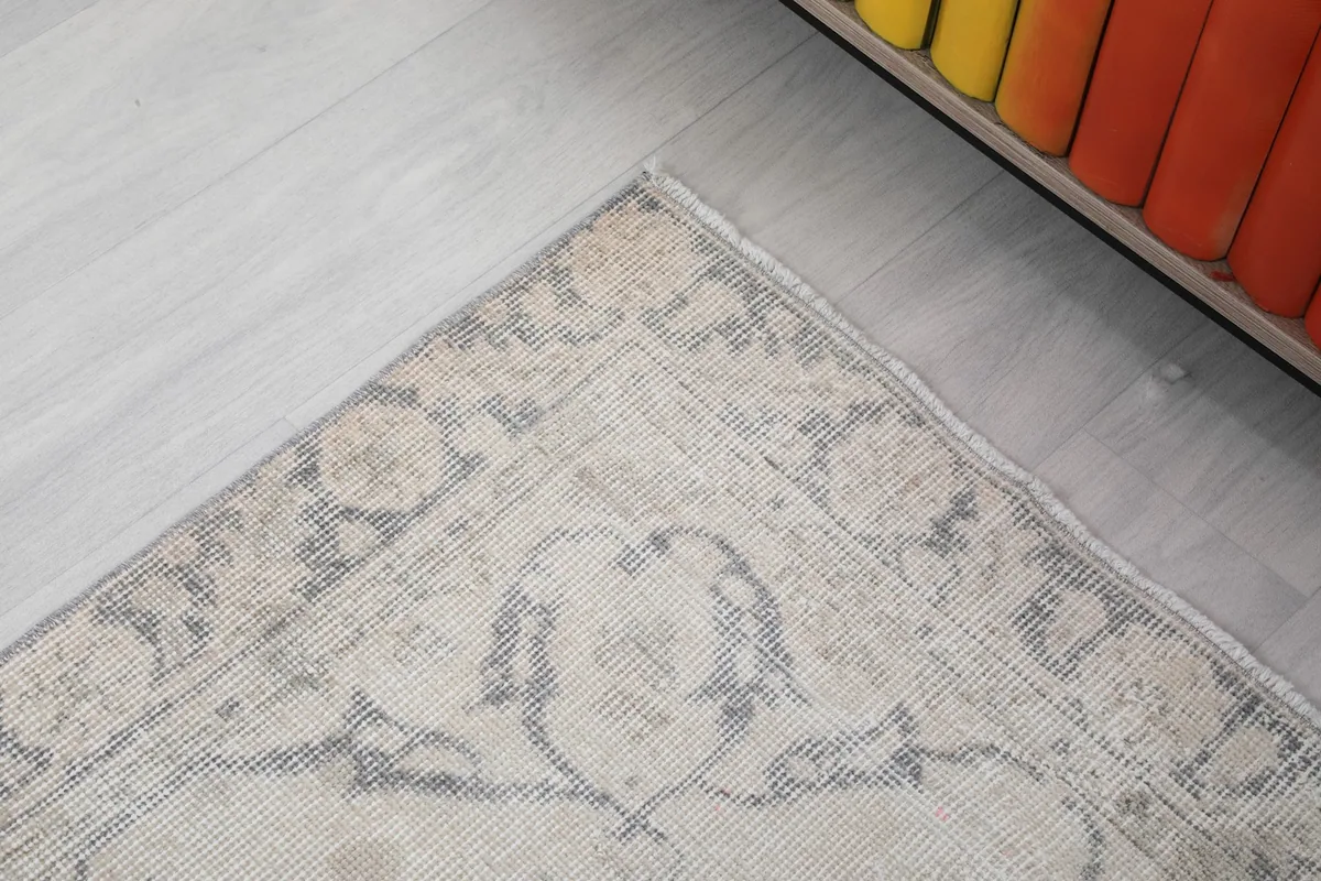 Close-up of the rug's border and a portion of the field, showing the transition of patterns