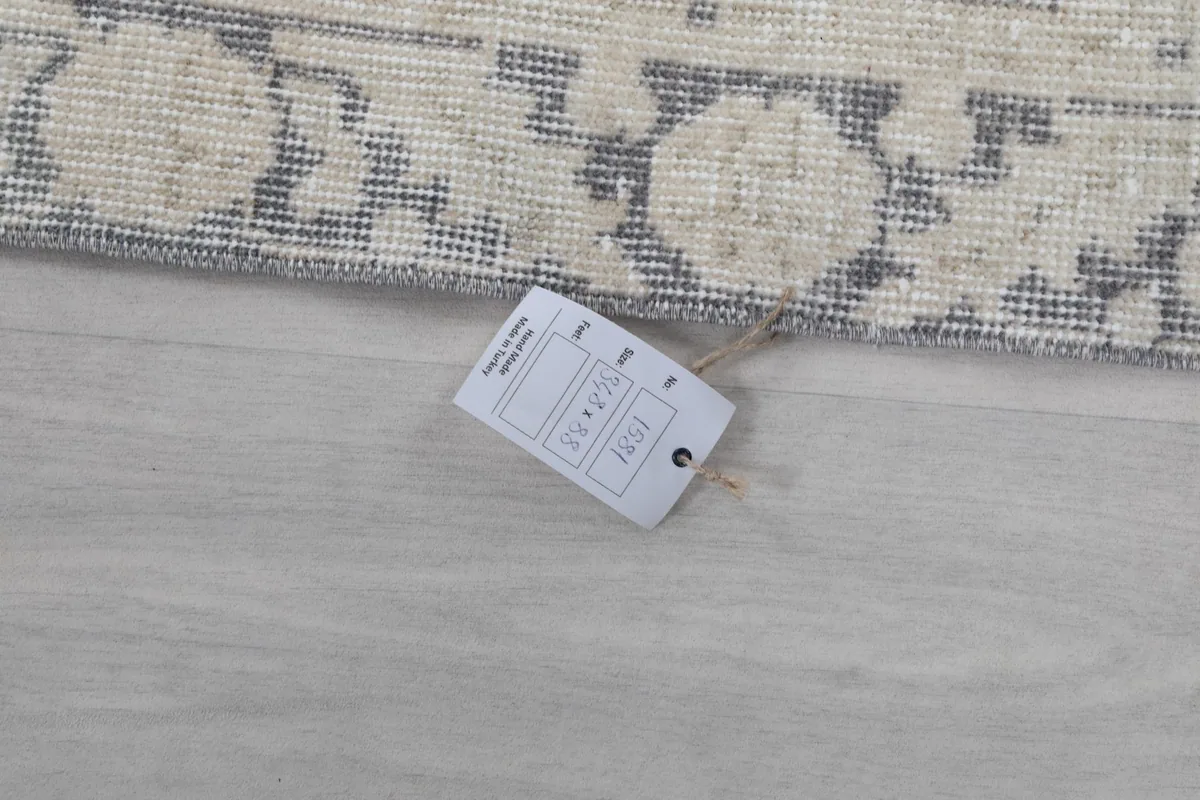 Image showing a tag with size information near the fringe of the vintage Anatolian runner rug
