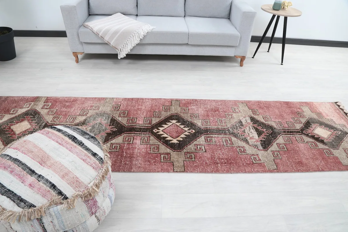 Full room view of the rose runner rug extending from the foreground to the background.