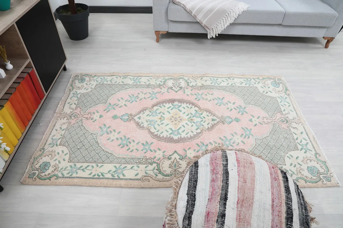 Overhead shot of the rug in a room, displaying its full design and proportions