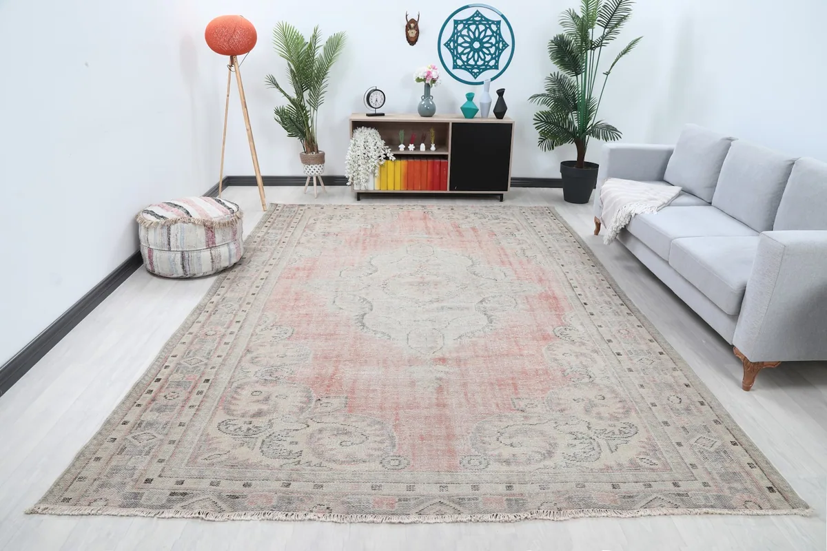 Vintage Anatolian rug with rose and beige tones in a modern living room setting