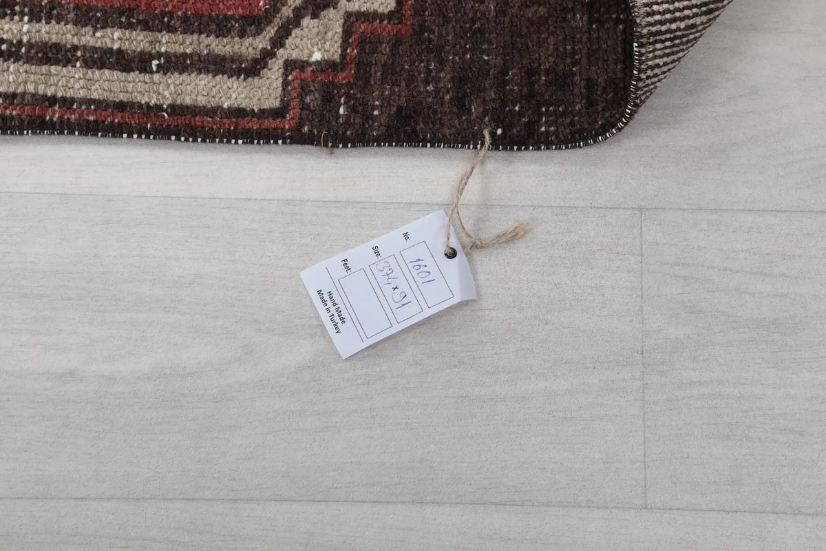 Product tag attached to the rug, displaying size and other information
