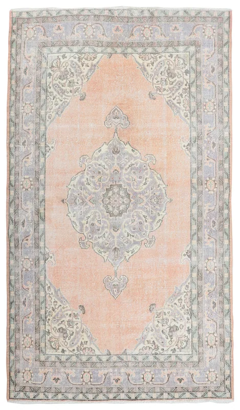 Full top view of the orange and gray vintage Anatolian area rug on a white background.