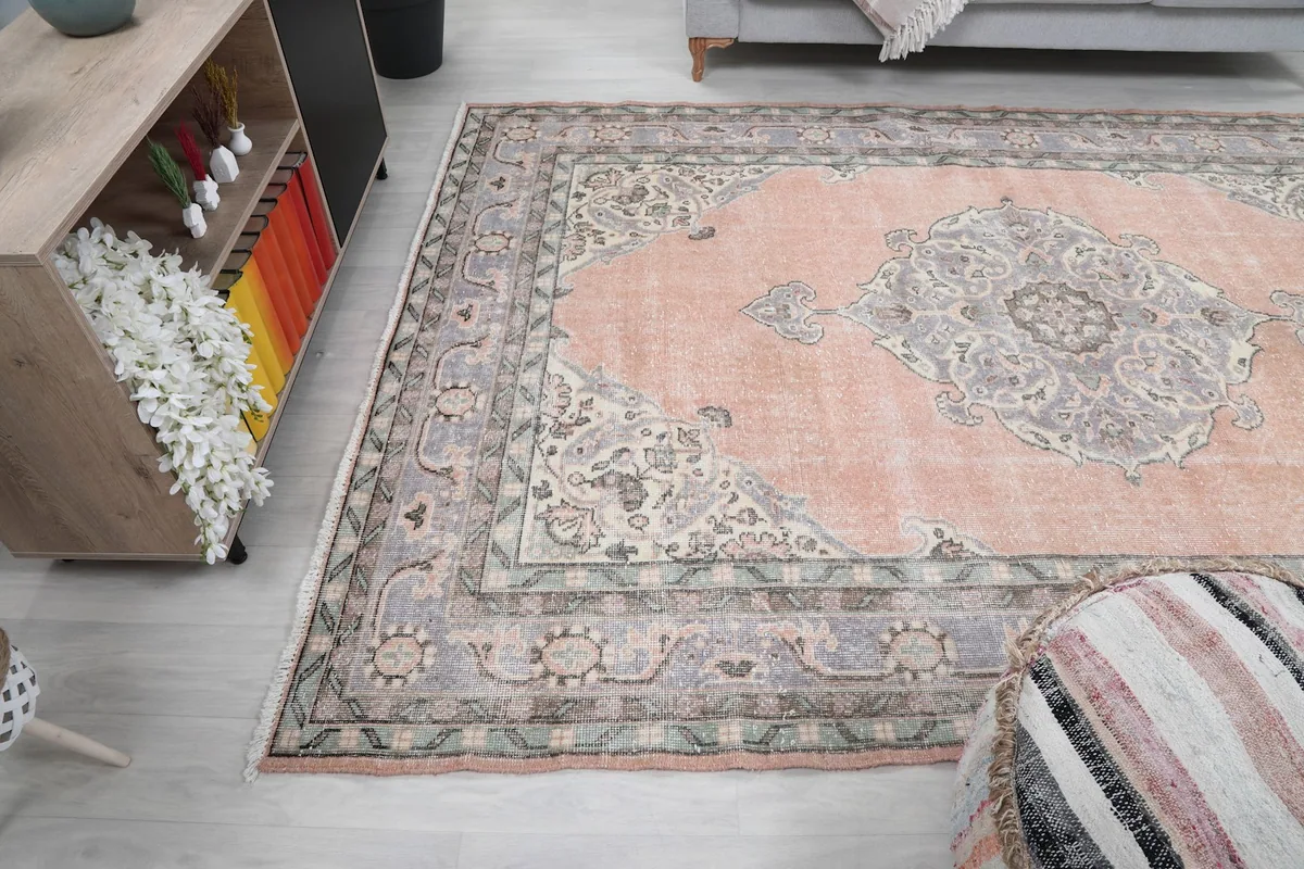 Angled view of the rug from the side, with part of the room visible.
