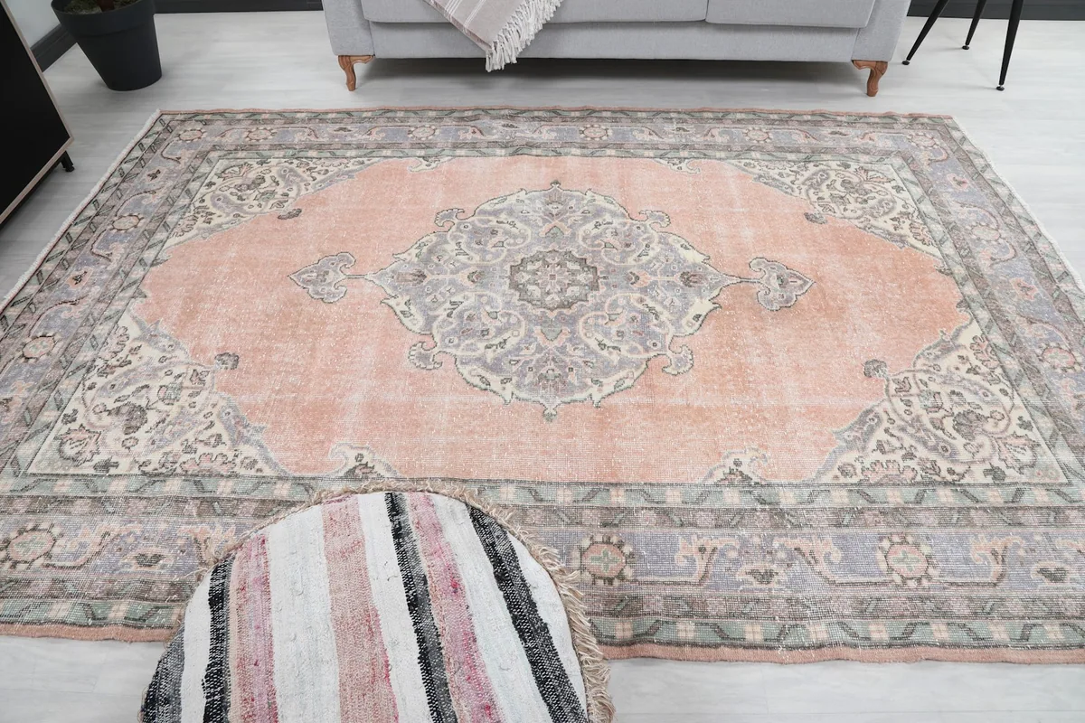 Full view of the rug in the room from a wider angle, including furniture.