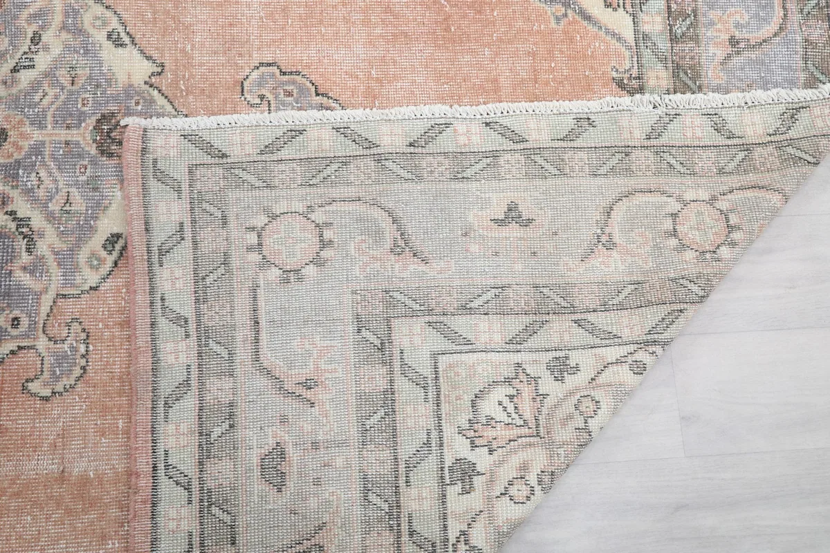 Another folded corner view, showing the construction and reverse side of the rug.