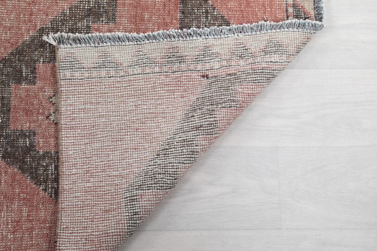 Another view of the rug's backside, revealing the consistent knotting and construction.