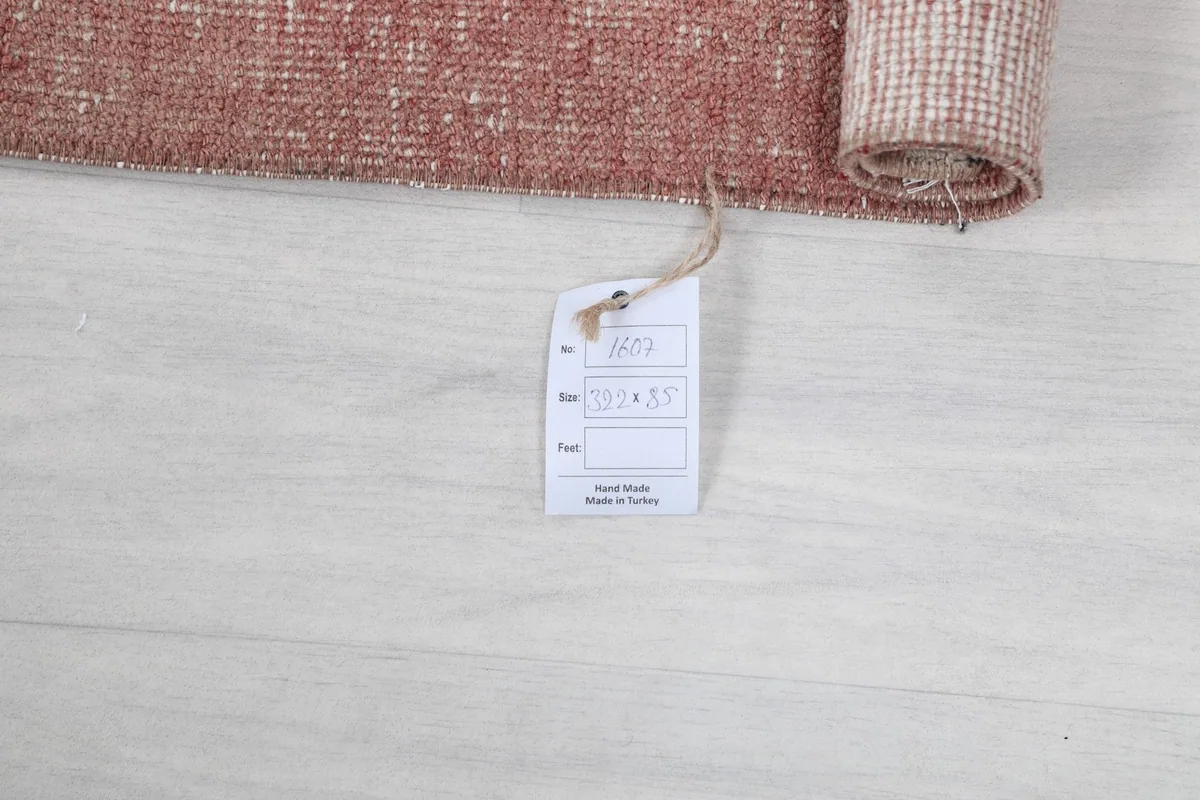 Close-up of the product tag indicating the rug's dimensions and origin.