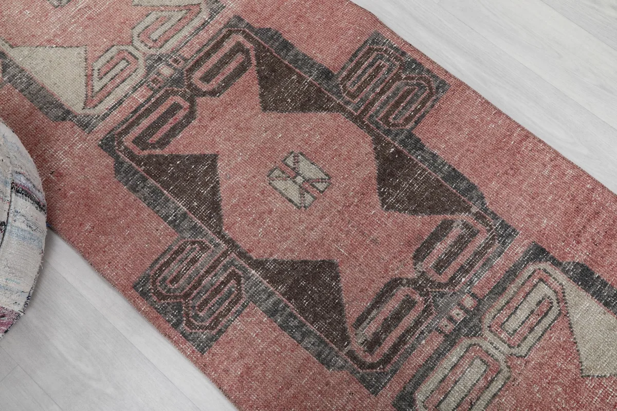Overhead angle showing a section of the runner with its distinct tribal geometric designs.