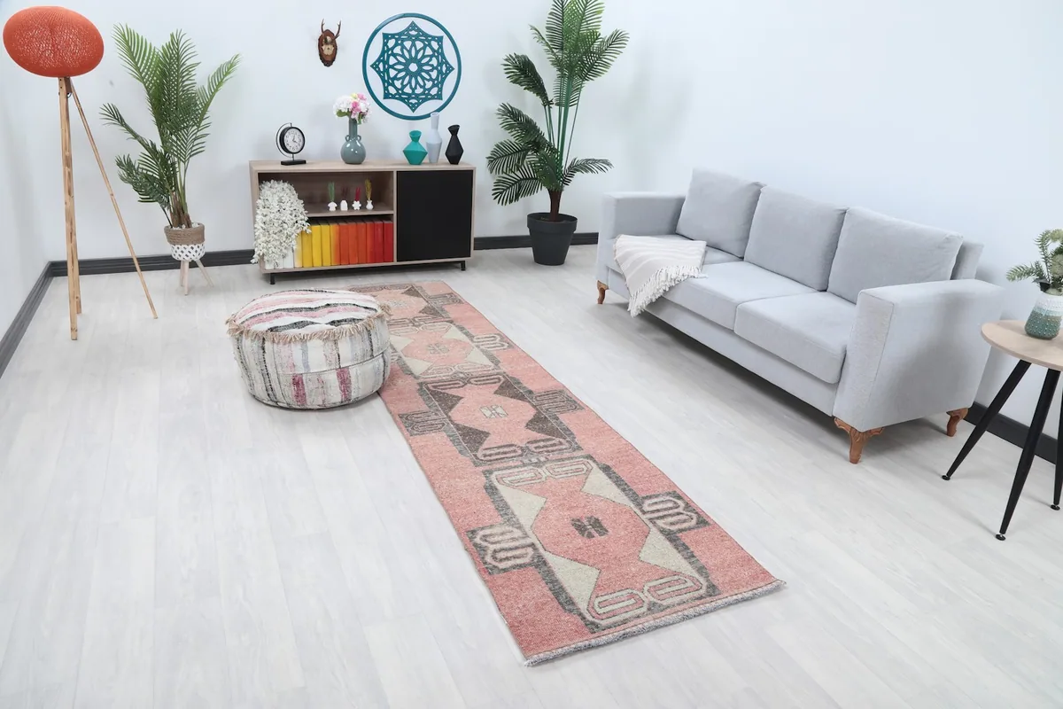 Angle view of the Anatolian runner rug showing its length and pattern in a light-filled room.