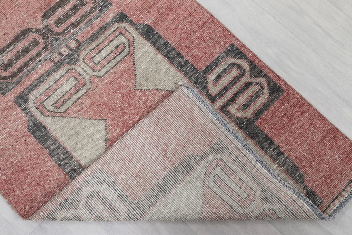Underside view of the hand-knotted runner, revealing the cotton foundation and construction.