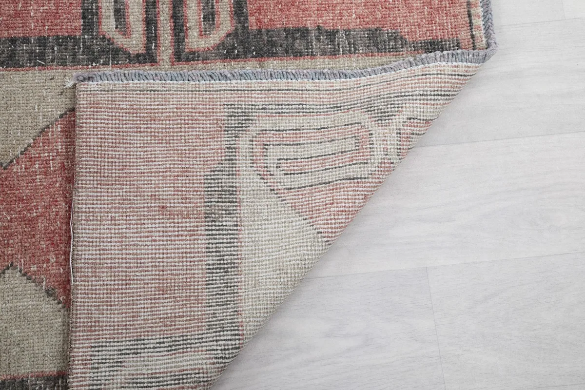 Another angle of the rug's back, showing the consistent knotting and sturdy foundation.