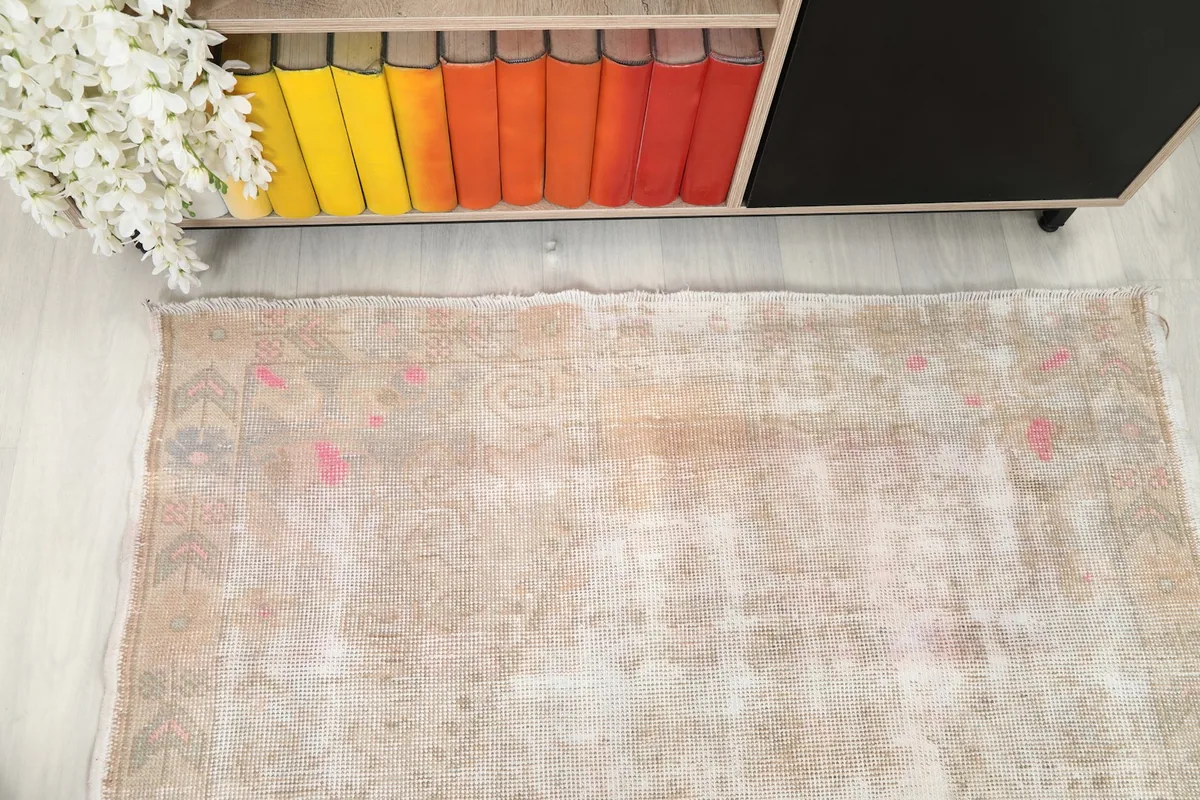 Overhead view of the rug on the floor, showcasing its overall appearance and shape