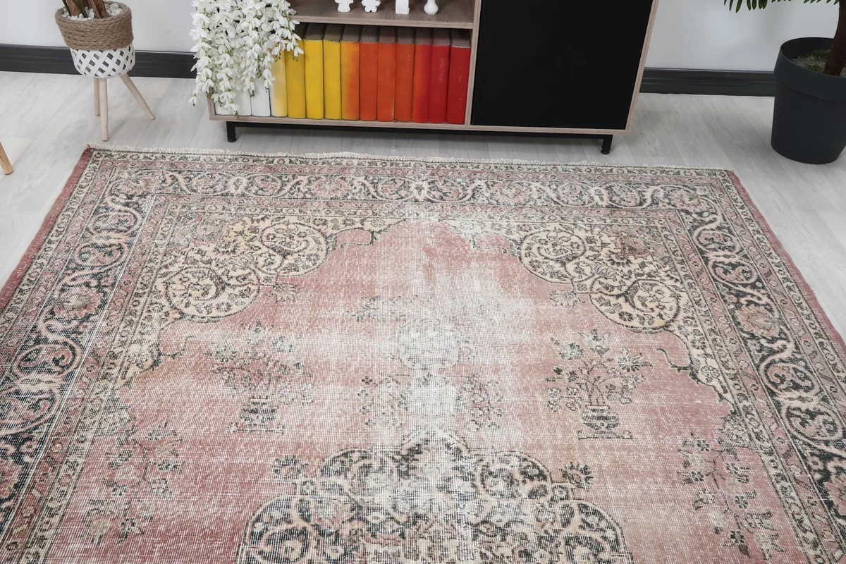 Overhead view of the rose area rug in a room, focusing on its placement and overall design