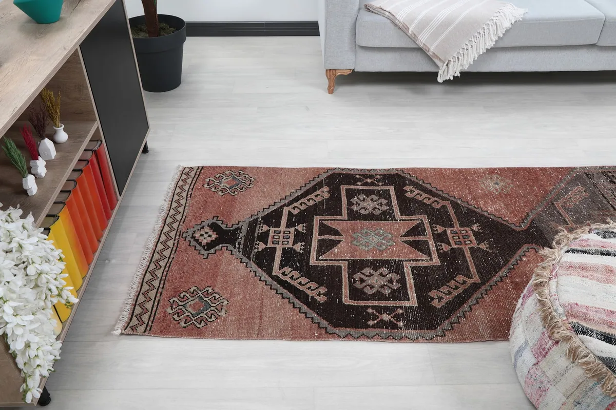 Angled room view of the runner rug, showing its length in relation to furniture