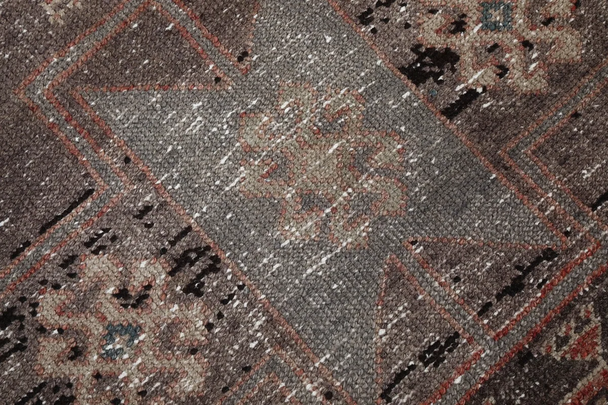 Macro shot of the wool pile, revealing texture, color nuances, and areas of wear