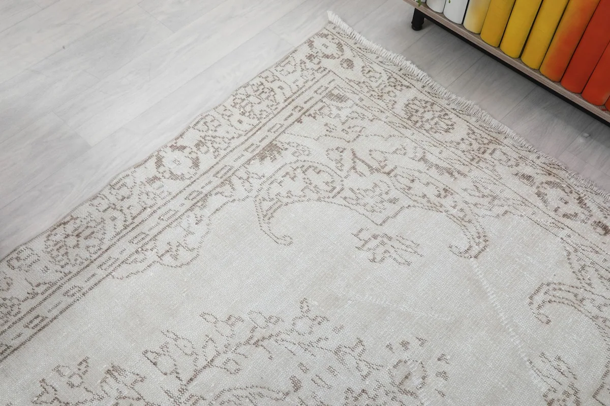 Detailed view of the rug's border design and corner patterns