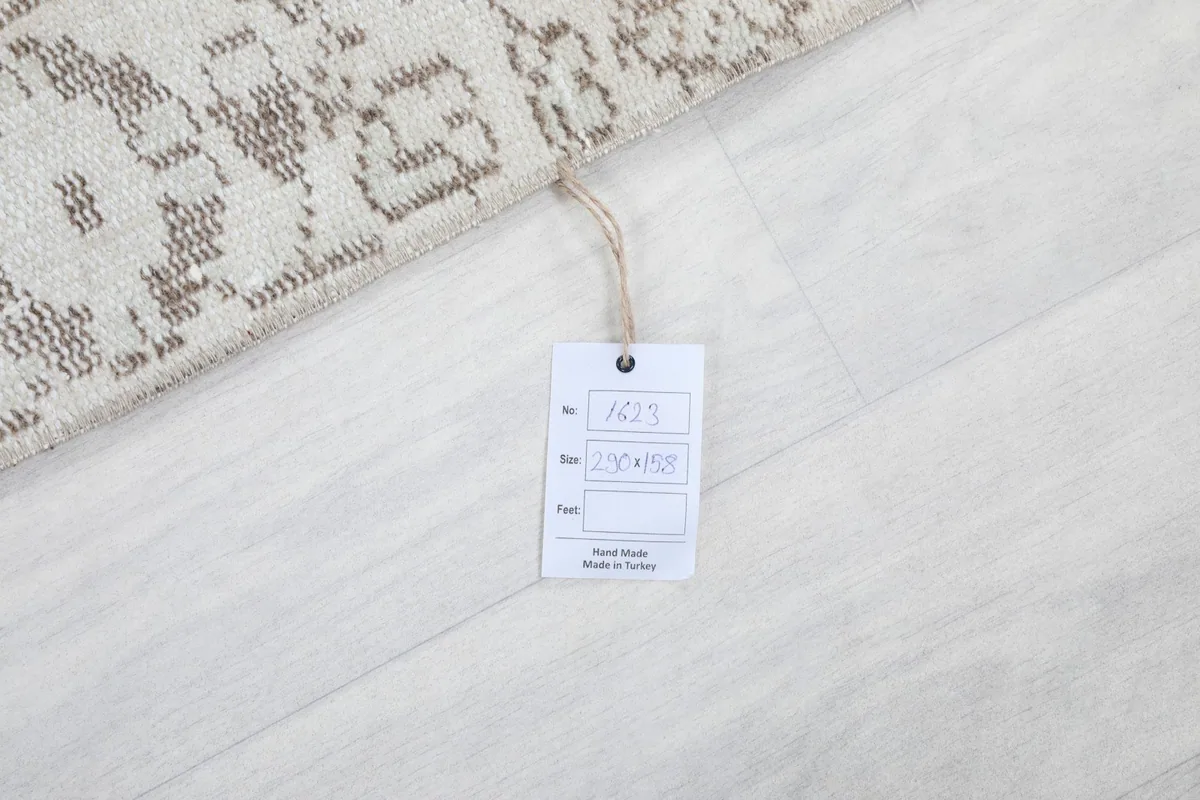 Product tag on the back of the rug, showing details like material and origin