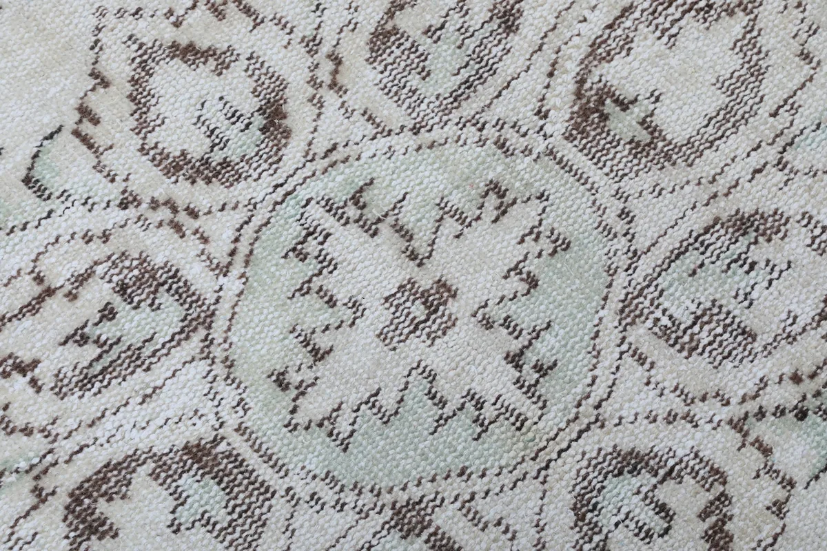 Macro detail of the hand-knotted wool pile, showing texture and color variation
