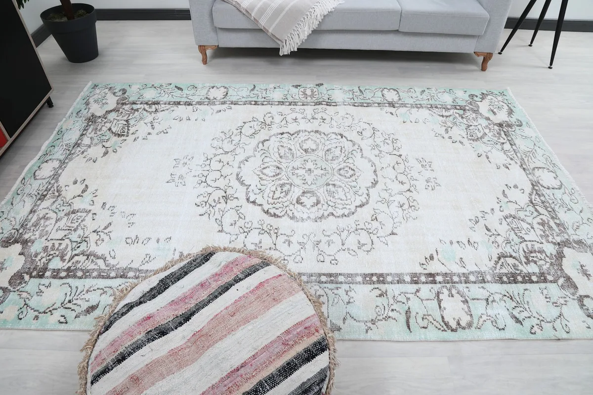 Overhead view of the rug, showcasing its full pattern and colors in the room
