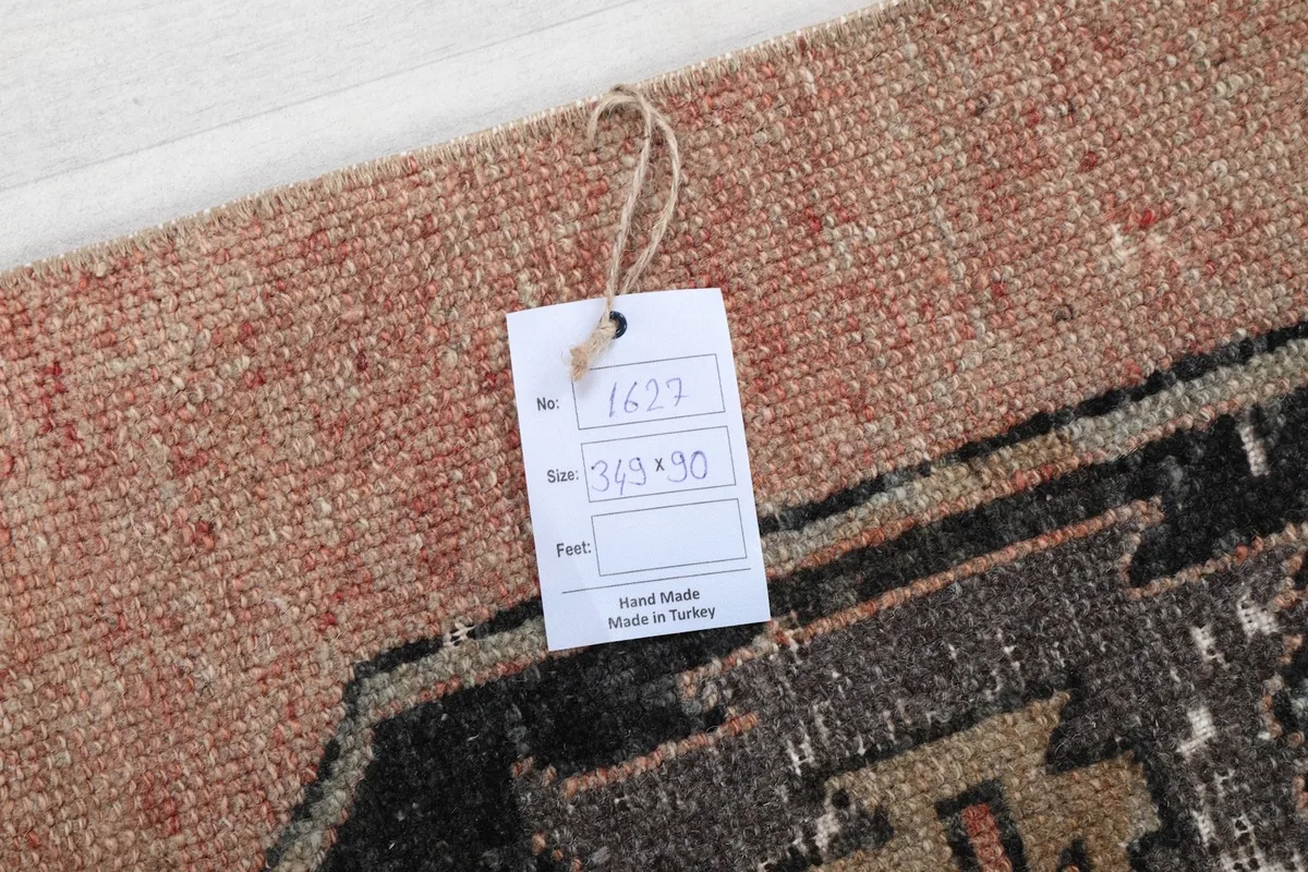 Close-up of the product tag attached to the rug, displaying size and origin information
