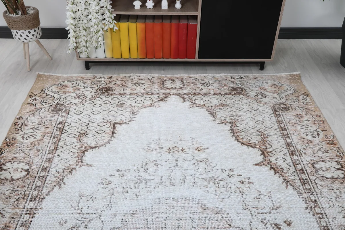 Overhead angled shot of the rug, focusing on the upper half and its medallion design.