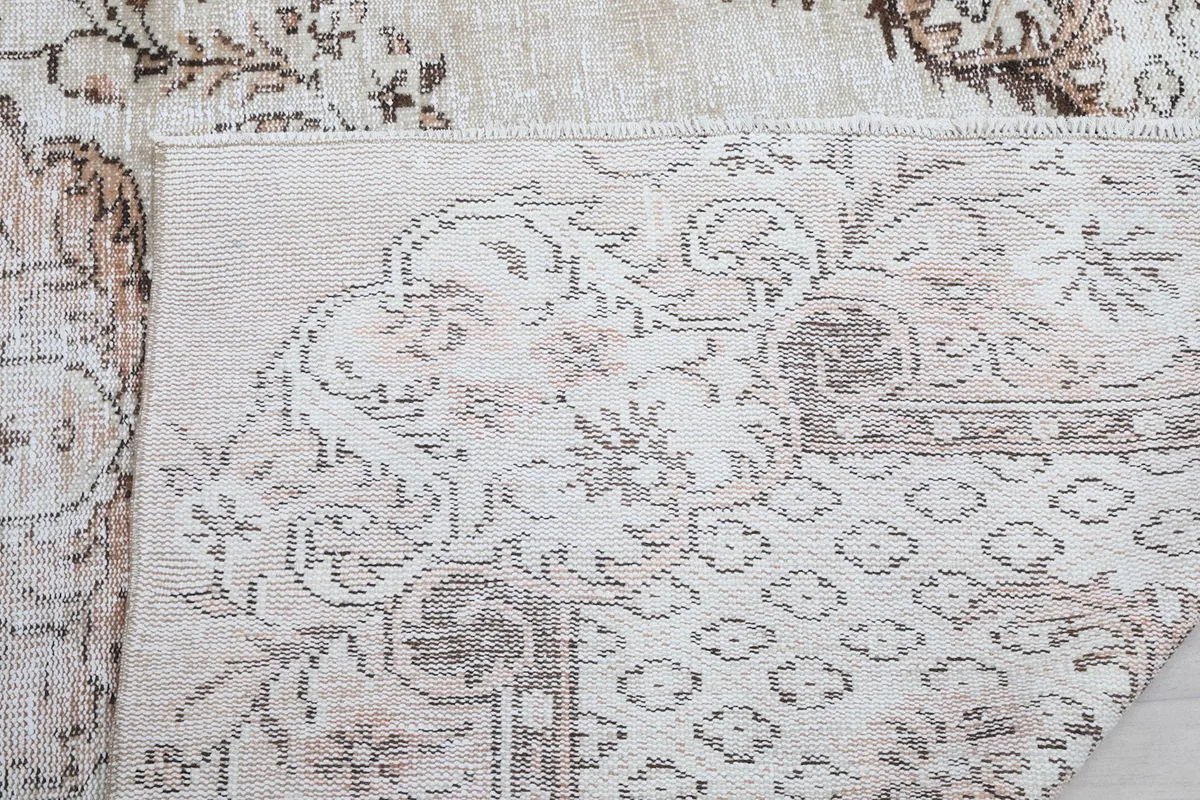 Close-up detail of the back of the rug, showing the consistent knotting and structure.