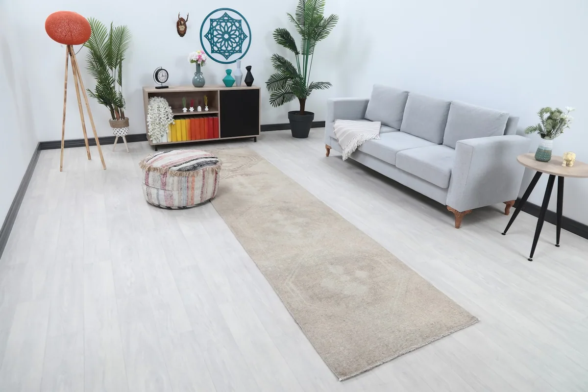 Angle view of the runner rug in a room, showing its length and subtle pattern