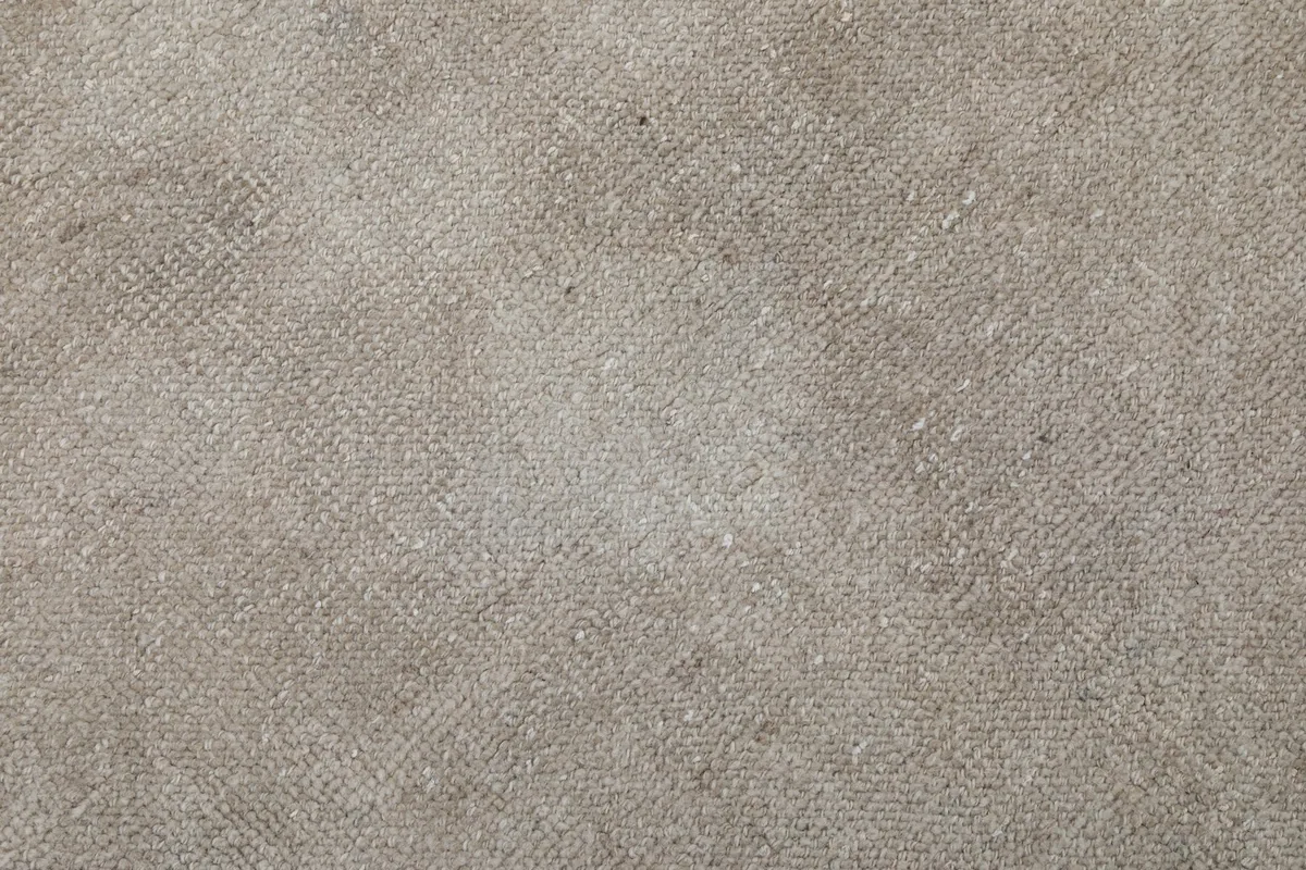 Macro shot of the hand-knotted wool pile, showing individual fibers and weave