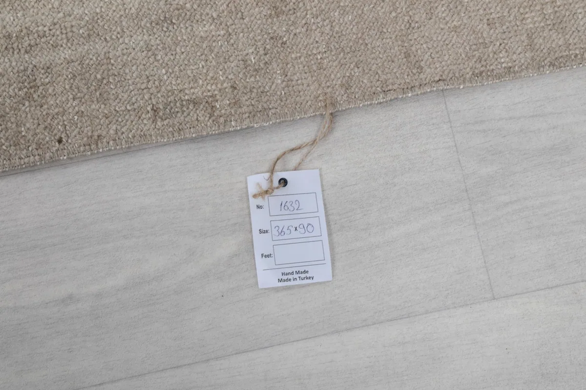 Close-up of the product tag, indicating hand-made in Turkey and rug details
