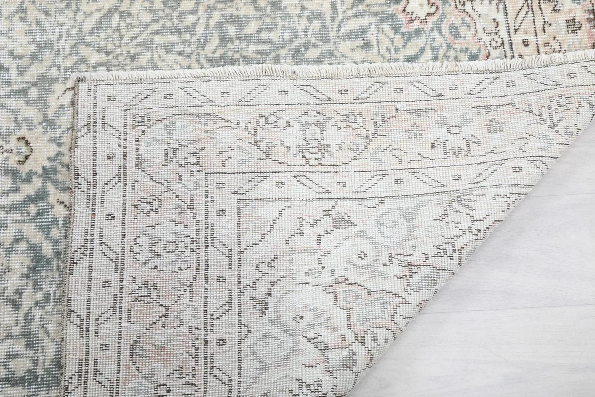 Another view of the rug's underside, showing the detailed knotting and construction.