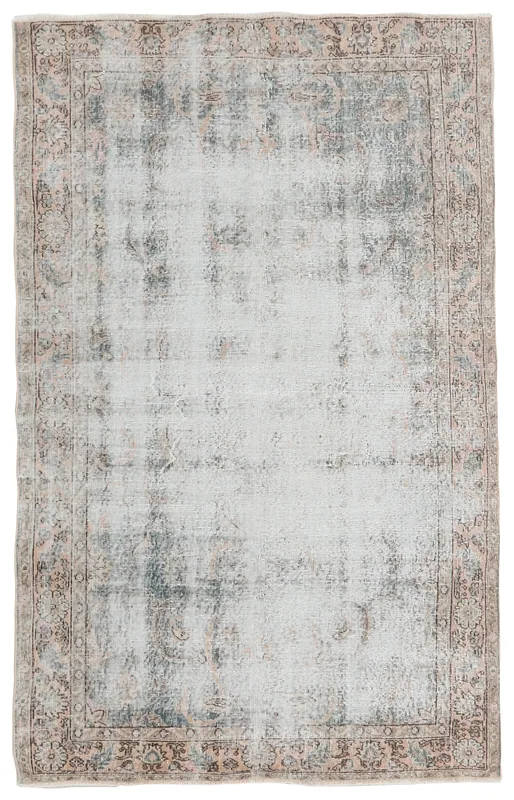Full top view of the ivory and gray distressed vintage Anatolian area rug on a white background.