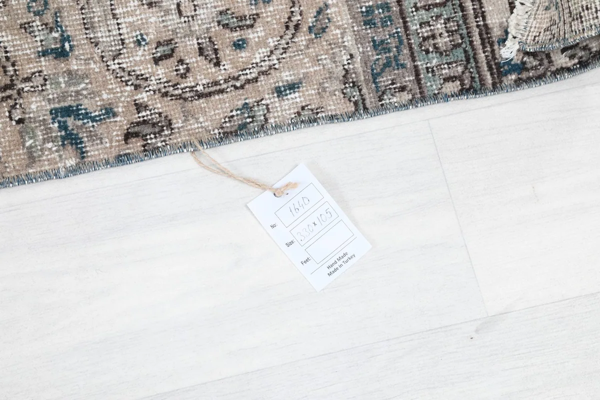 Product tag attached to the rug, displaying details like material and origin