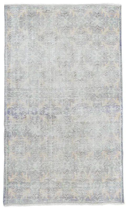 Full overhead view of the gray and blue vintage Anatolian rug