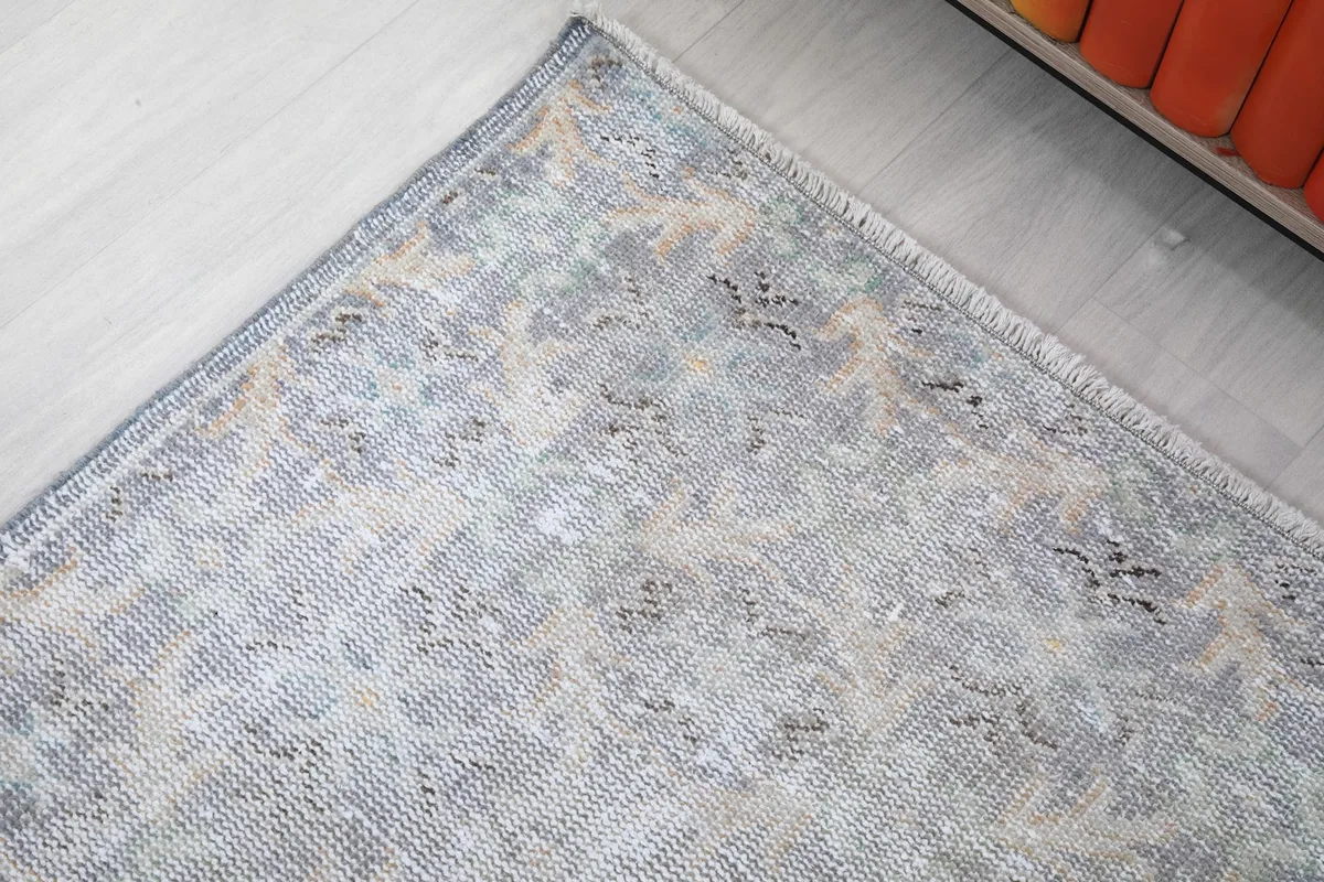 Corner detail of the rug, showing the subtle color variations