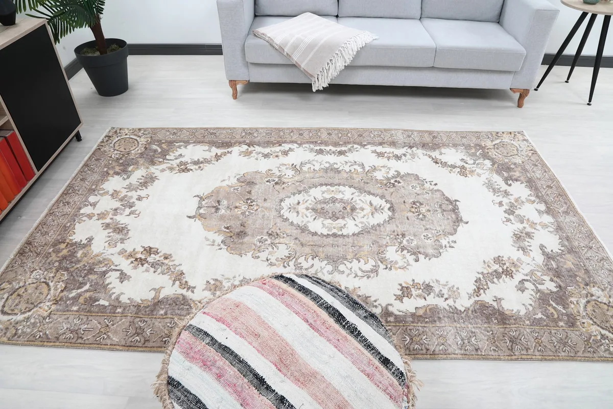 Frontal view of the rug in a room, showing its full length and the central medallion as a focal point.