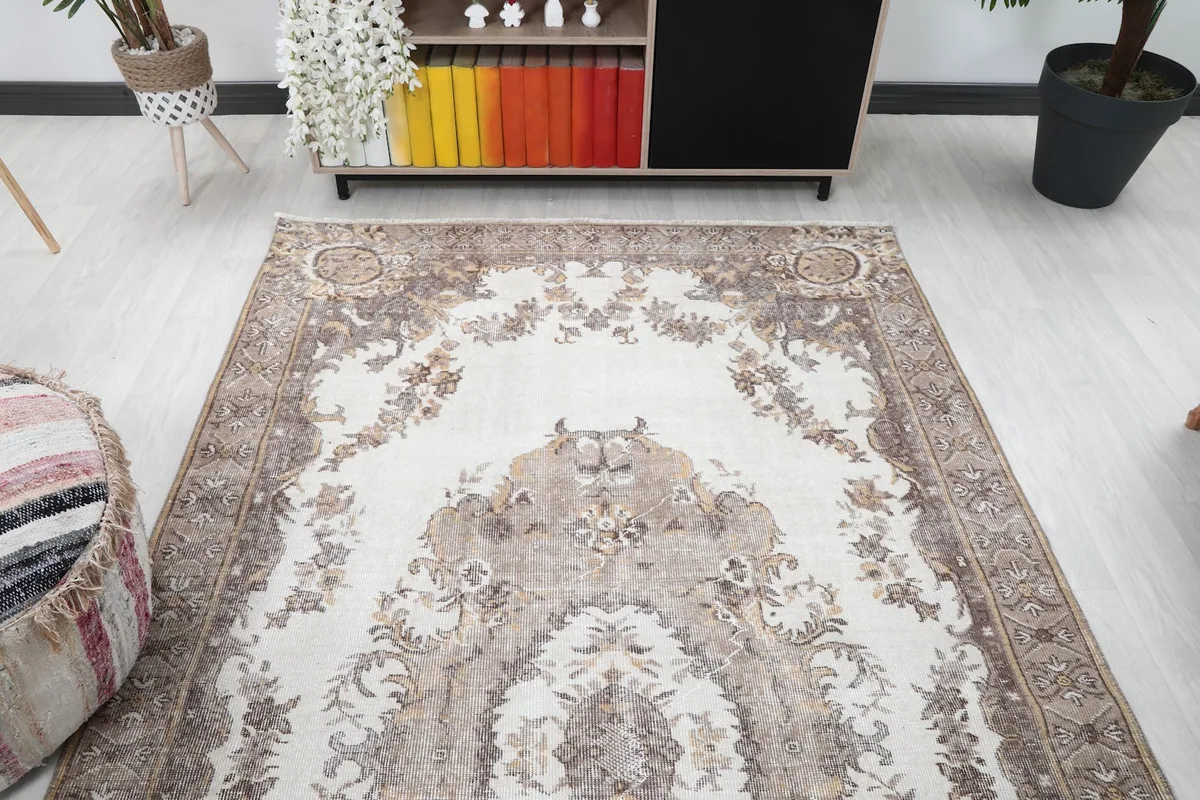 Overhead view showing the rug's full design from one end, highlighting the symmetrical medallion and floral motifs.