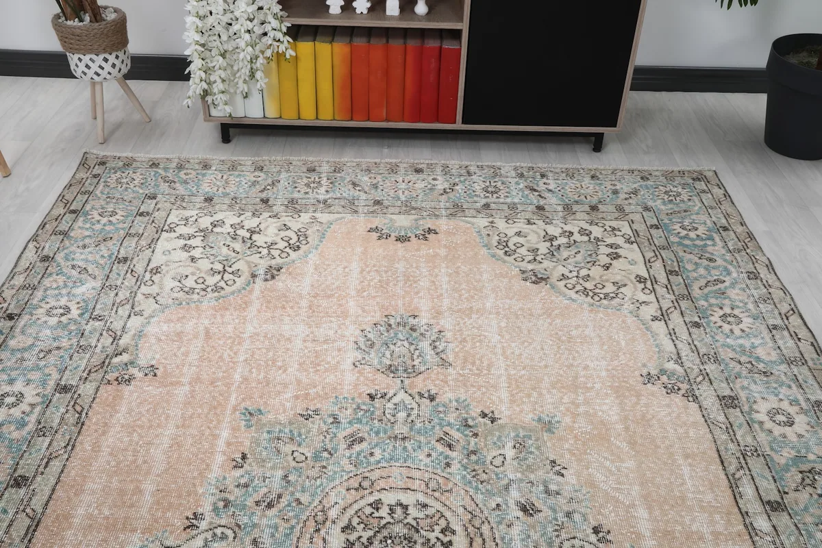 Overhead view of the rug in a room, showcasing the full design and its interaction with furniture.