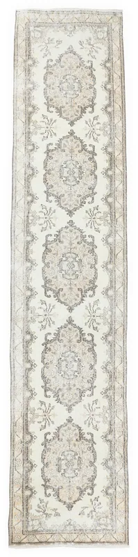 Full top view of the vintage Anatolian runner rug with ivory, gray, and tan colors