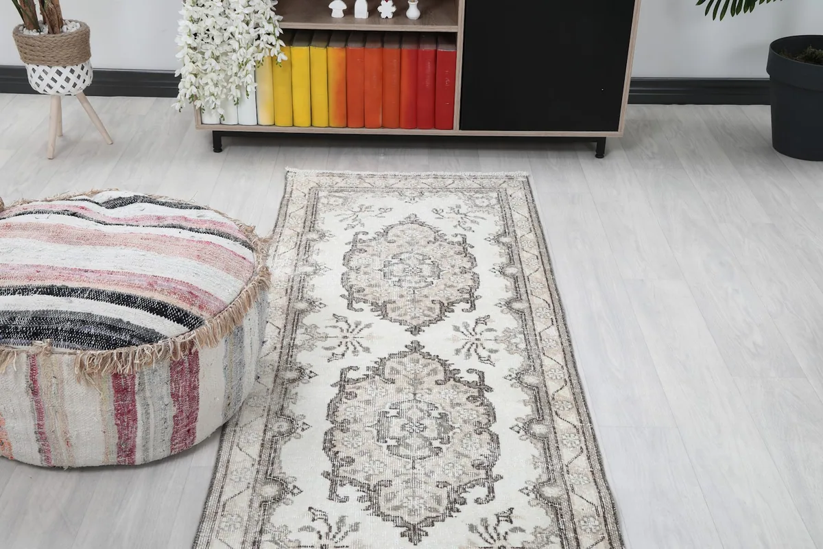 Runner rug from a lower perspective within a room, showing its full design