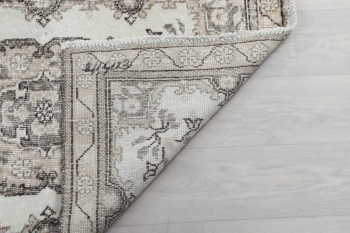 Another folded corner view, highlighting the rug's reverse side and weave