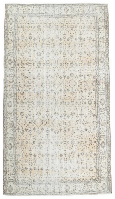 Full top view of the 6'8" x 10'0" ivory and gray vintage Anatolian rug