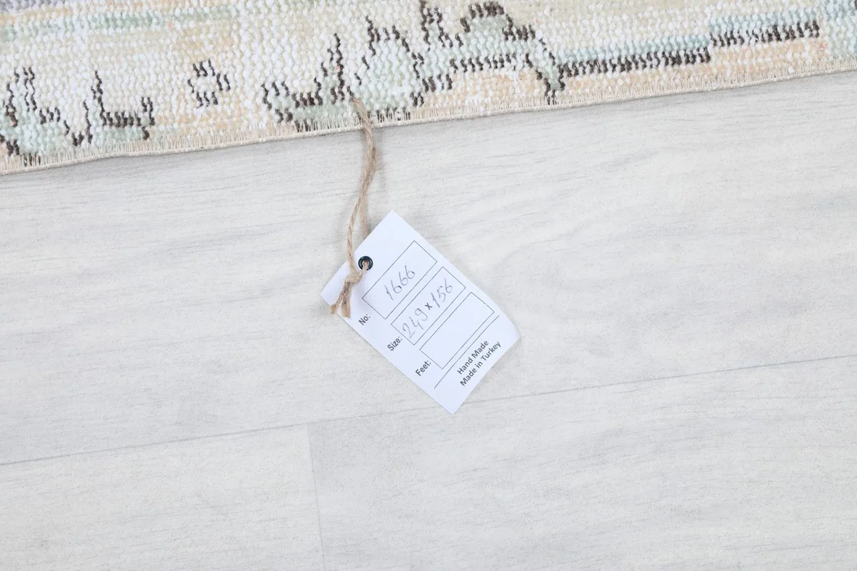 Product tag attached to the rug, displaying item number and origin information