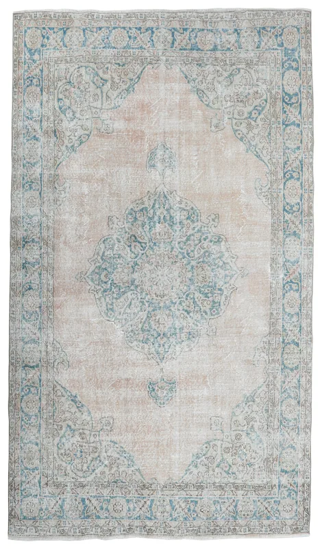 Full overhead view of the vintage beige and blue Anatolian area rug