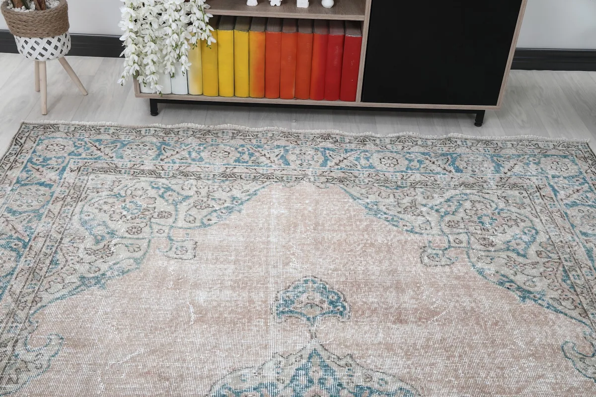 Overhead angle view focusing on the upper part of the rug with its intricate patterns