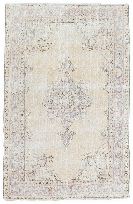Full top view of the 4x6 ivory and purple vintage Anatolian rug on a white background