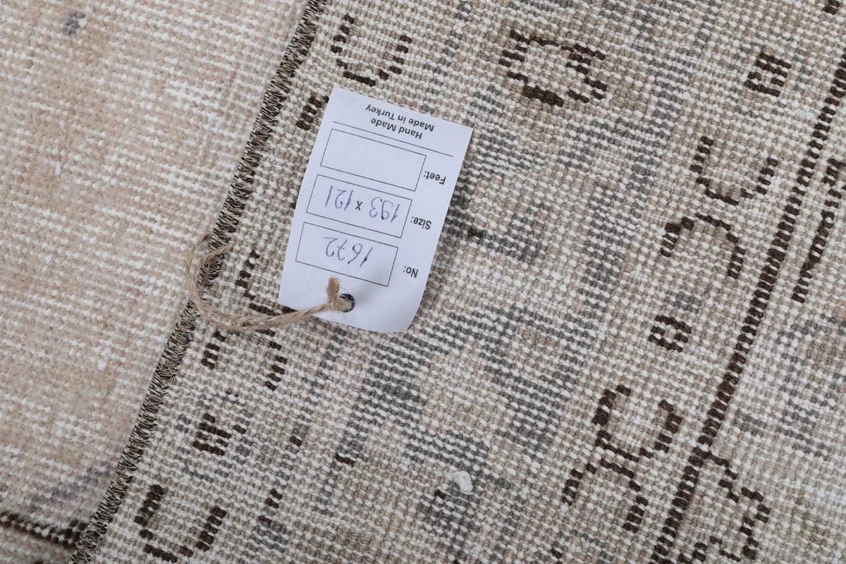 Product tag attached to the back of the rug, displaying size and origin details